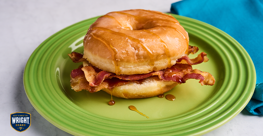 Apple Fritter Bacon Bliss Breakfast Sandwich with bacon, apple cider and brown sugar on an apple fritter