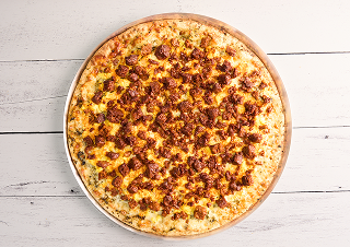 golden pizza crust topped with chile verde, melted mozzarella cheese, scrambled eggs and smoky pork chorizo
