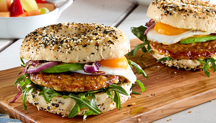 sausage and egg bagel sandwich with everything seasoning on the bagel