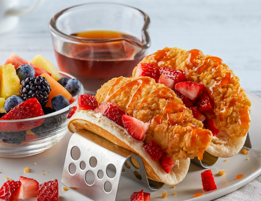 Chicken and pancake breakfast tacos with a maple cream cheese spread in a pancake