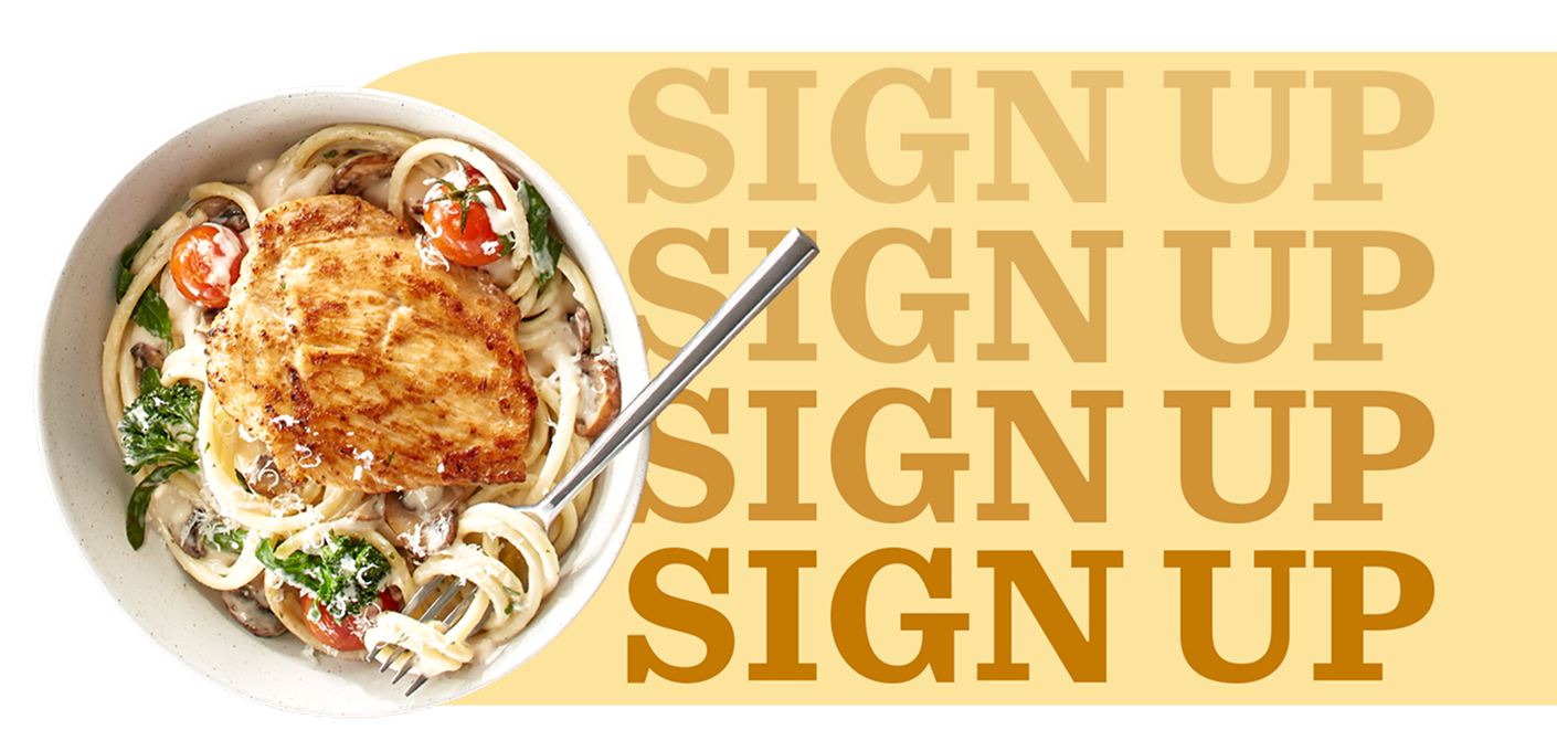 Ramen noodles, bacon, soft-boiled eggs and baby bok choy in a bowl of clear broth