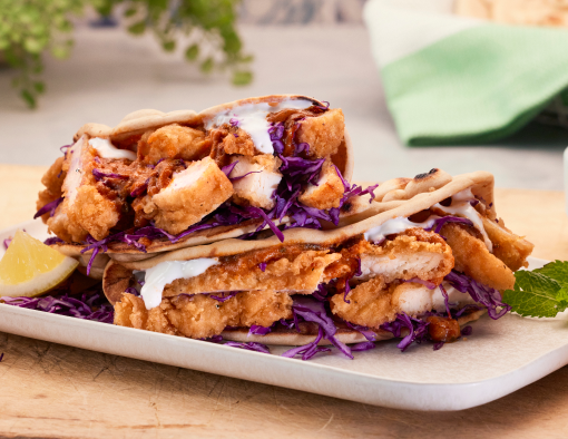crispy chicken breast filet tossed in a spicy tikka masala sauce served wrapped in freshly baked, golden-brown roti