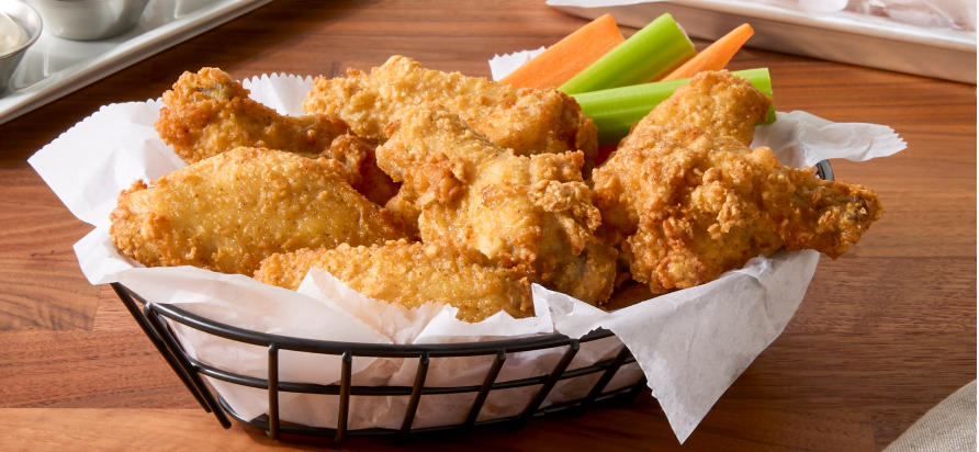 Tyson® Honey Stung® Fully Cooked Lightly Breaded Hot Honey Bone-In Chicken Wing Sections, Jumbo in restaurant setting