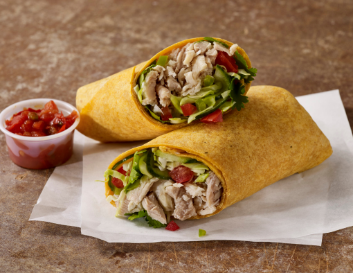 Pulled chicken cucumber ranch slaw, diced tomatoes, cilantro in a whole-grain tortilla halved 