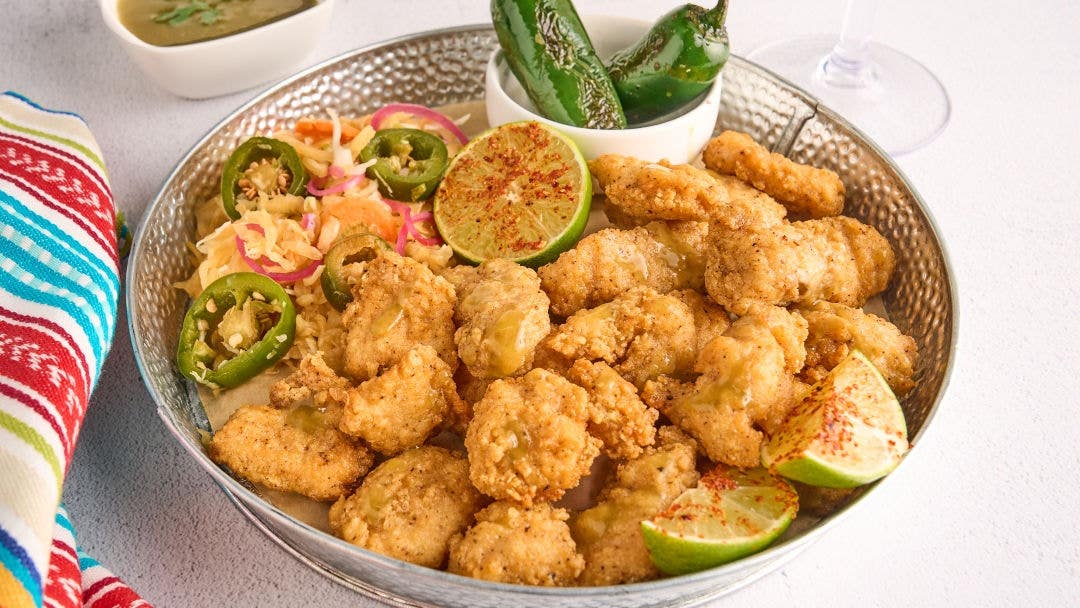 Crispy hot honey boneless wings with a smoky charred jalapeño lime butter