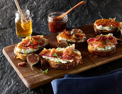Bacon & Fig Toast on a wood serving tray