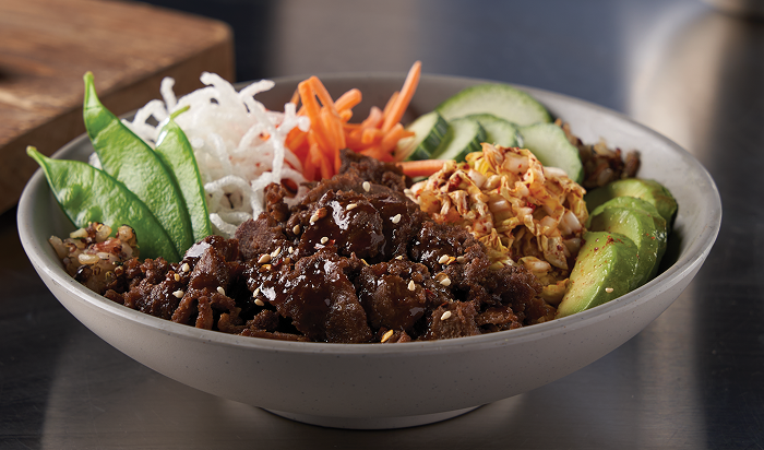 entrée featuring Steak-EZE® Redi-Steak® Fully Cooked Seasoned Sliced Beef in restaurant setting
