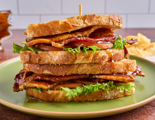 Crisp lettuce and juicy tomato add freshness, all layered on toasted, thick-sliced sourdough