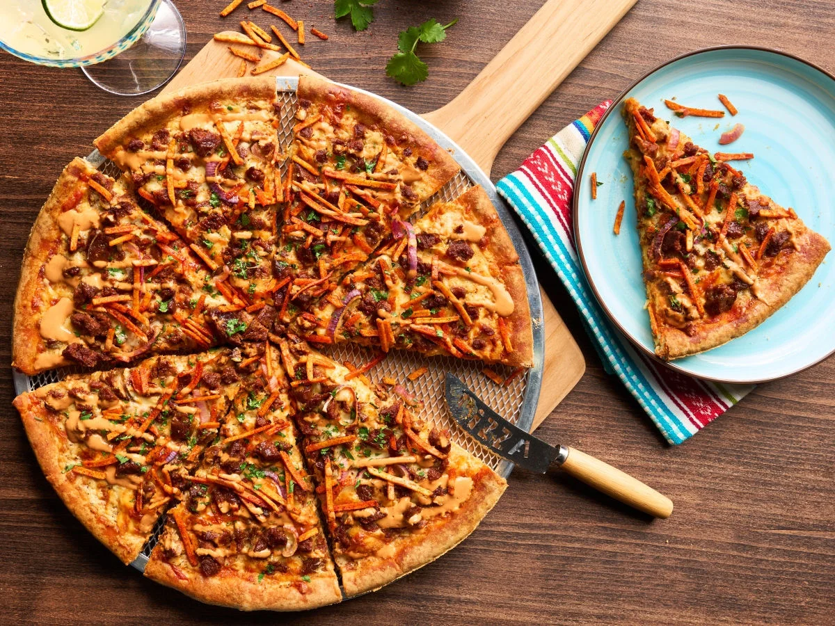 Sliced pizza on a serving board