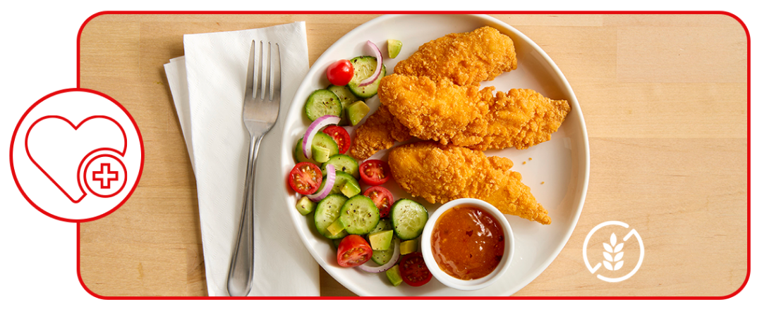 breaded chicken grain bowl in dining environment