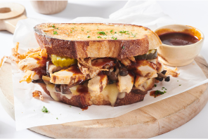 Chicken sandwich with pickles, bbq on a sourdough bread