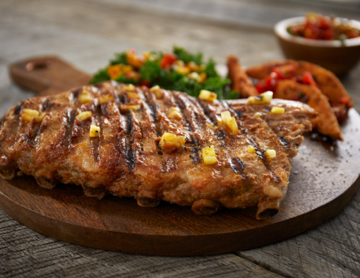 Pineapple Sriracha St. Louis-Style Ribs Recipe on a cutting board