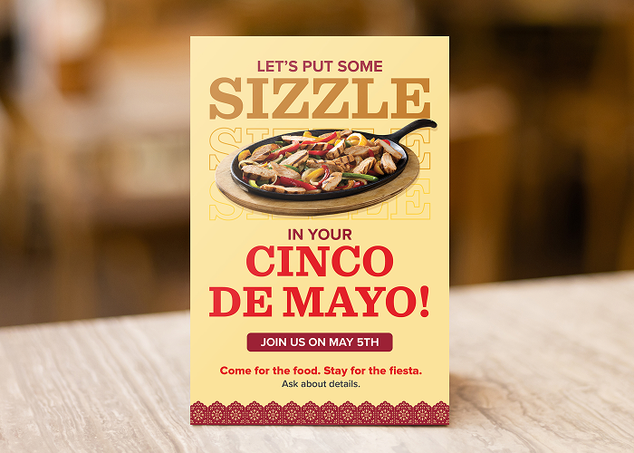 Cinco de Mayo promotional table card on the edge of a table