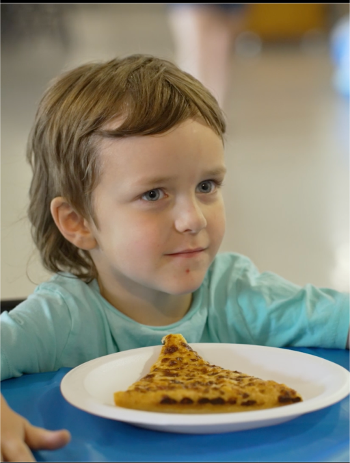 Child eating pizza