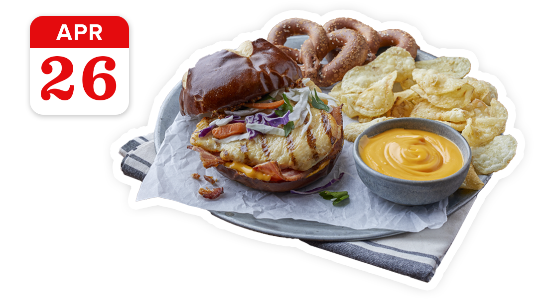 A chicken sandwich with beer cheese, soft pretzels and some chips