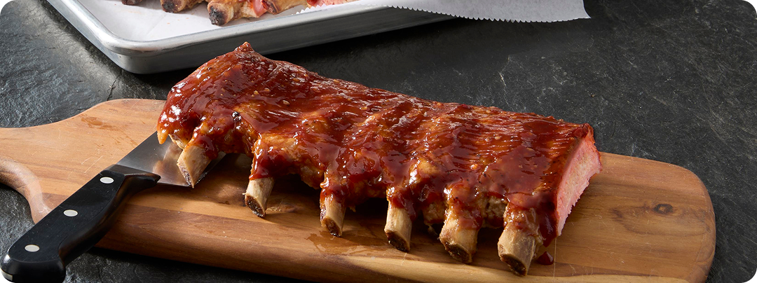 Pork ribs on a wooden cutting board