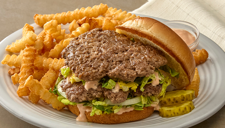 smash burger with a side of fries