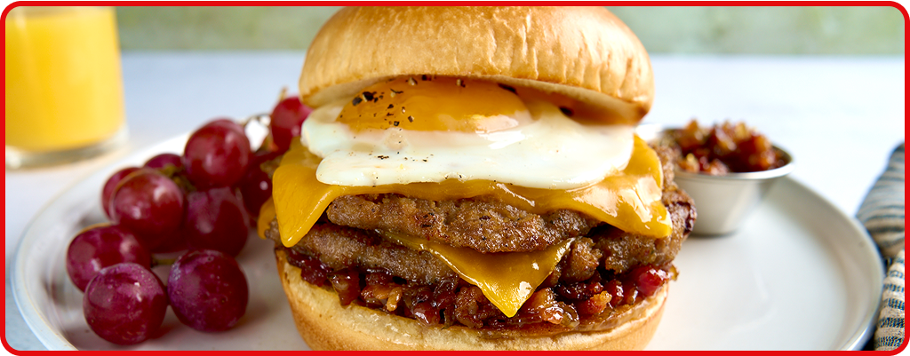 Sausage and egg sandwich served on a plate