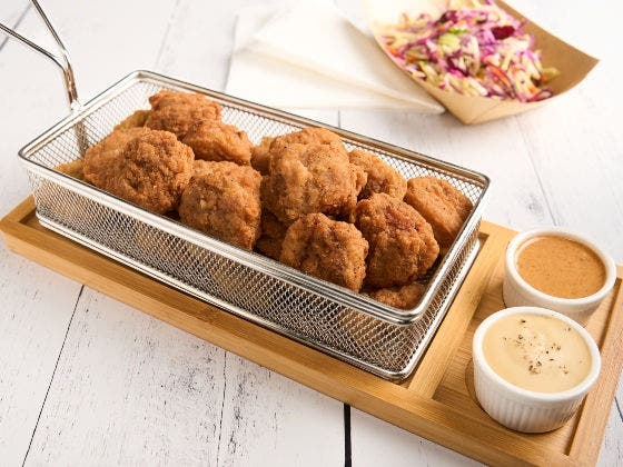 Spicy breaded beef bites served with maple mustard dip, beer cheese sauce and broccoli slaw on the side
