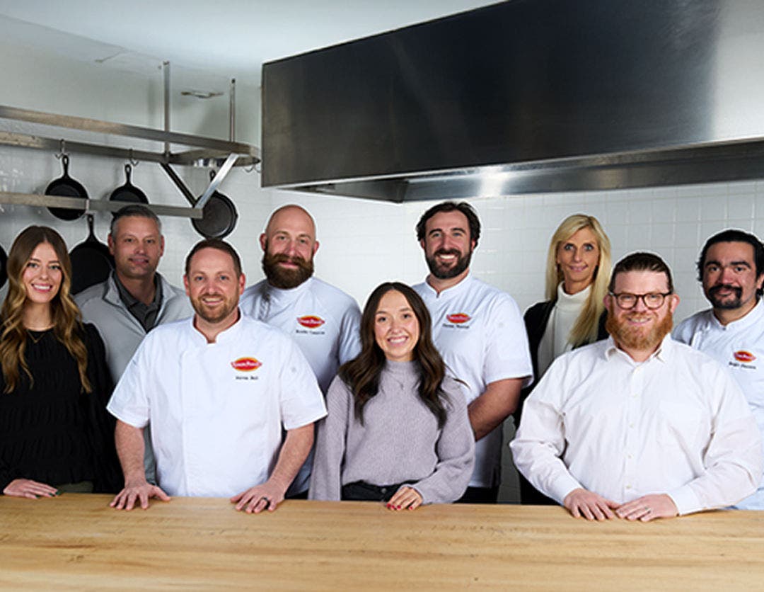 Tyson team member group photo in kitchen setting