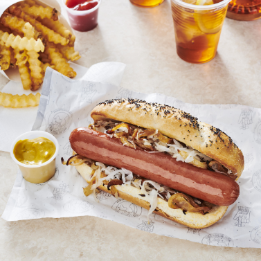 Image of dinner sausage with mustard. 