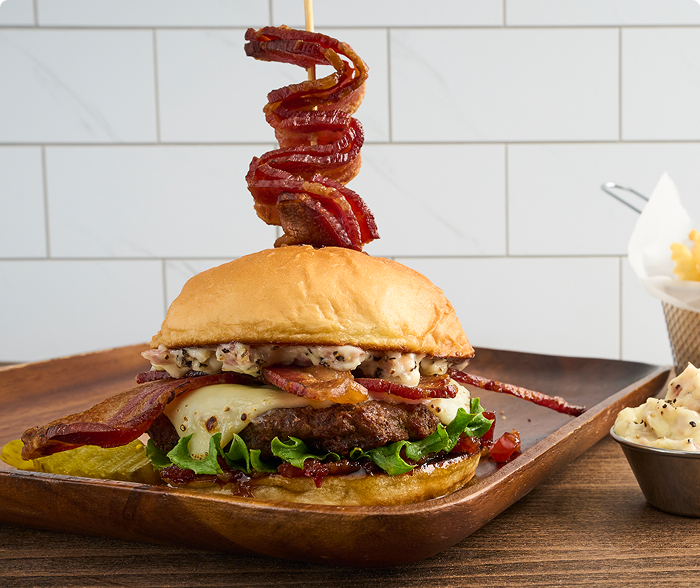 Big-Big Bacon Burger on a wood plate
