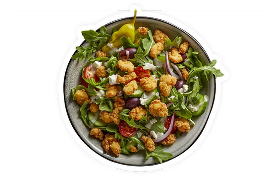 Mediterranean salad with mixed greens, crispy chicken, tomatoes, cucumber, olives, red onion, feta, and creamy dressing