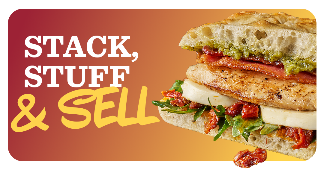A juicy grilled chicken breast on focaccia bread with thick cuts of mozzarella cheese, sliced bacon and tomatoes. 