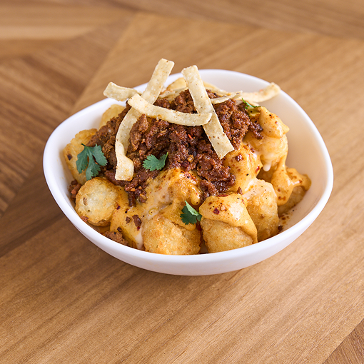 Tots topped with chorizo and cheese