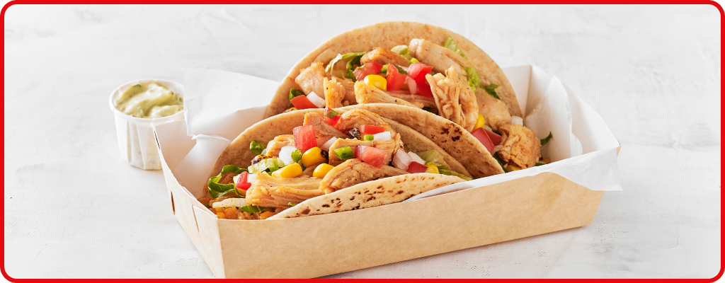 Tacos topped with corn, pico de gallo