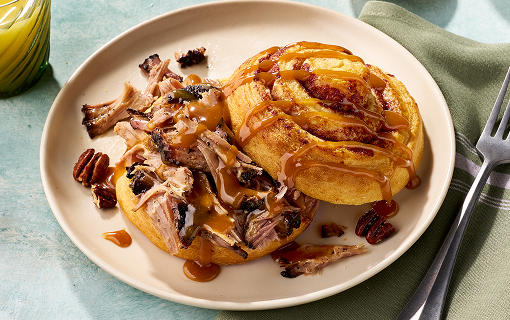 Cinnamon roll topped with pork butt
