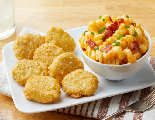 Tempura nuggets with a side of maccaroni and cheese with bacon. 