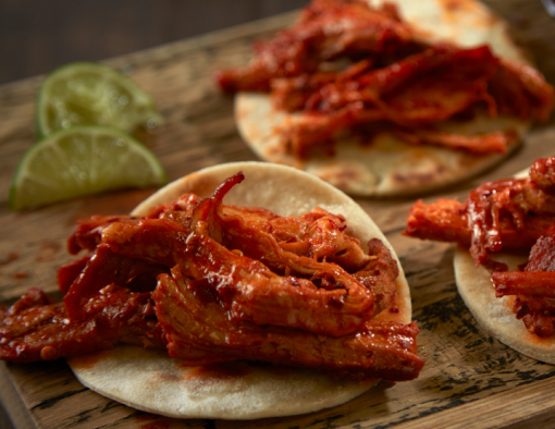 Tequila Braised Pork Carnitas with a sliced lime on the side