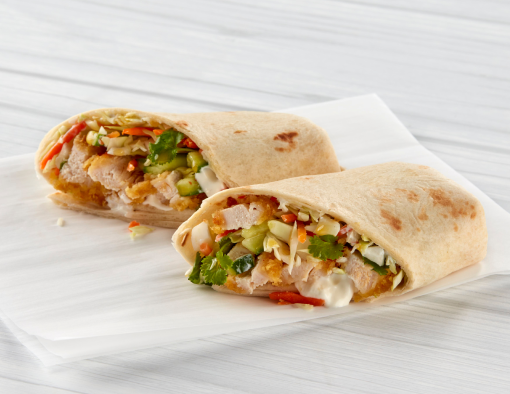 Strips of breaded chicken filets, sriracha mayo and Asian-style slaw stuffed in a flour tortilla and halved 