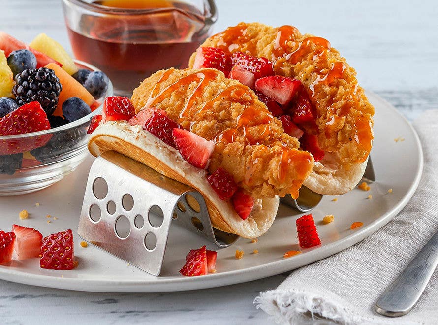 Chicken and Pancake Breakfast Tacos with a side of fruit on plate