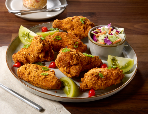 Pimento Cheese Rubbed Wings on a grey plate with a side of slaw