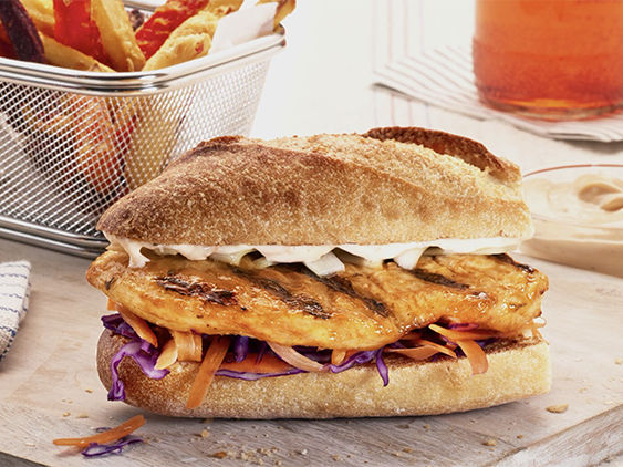 Grilled Jerk Chicken Sandwich Featuring Tyson Red Label® Authentically Grilled Chicken Breast Filets.
