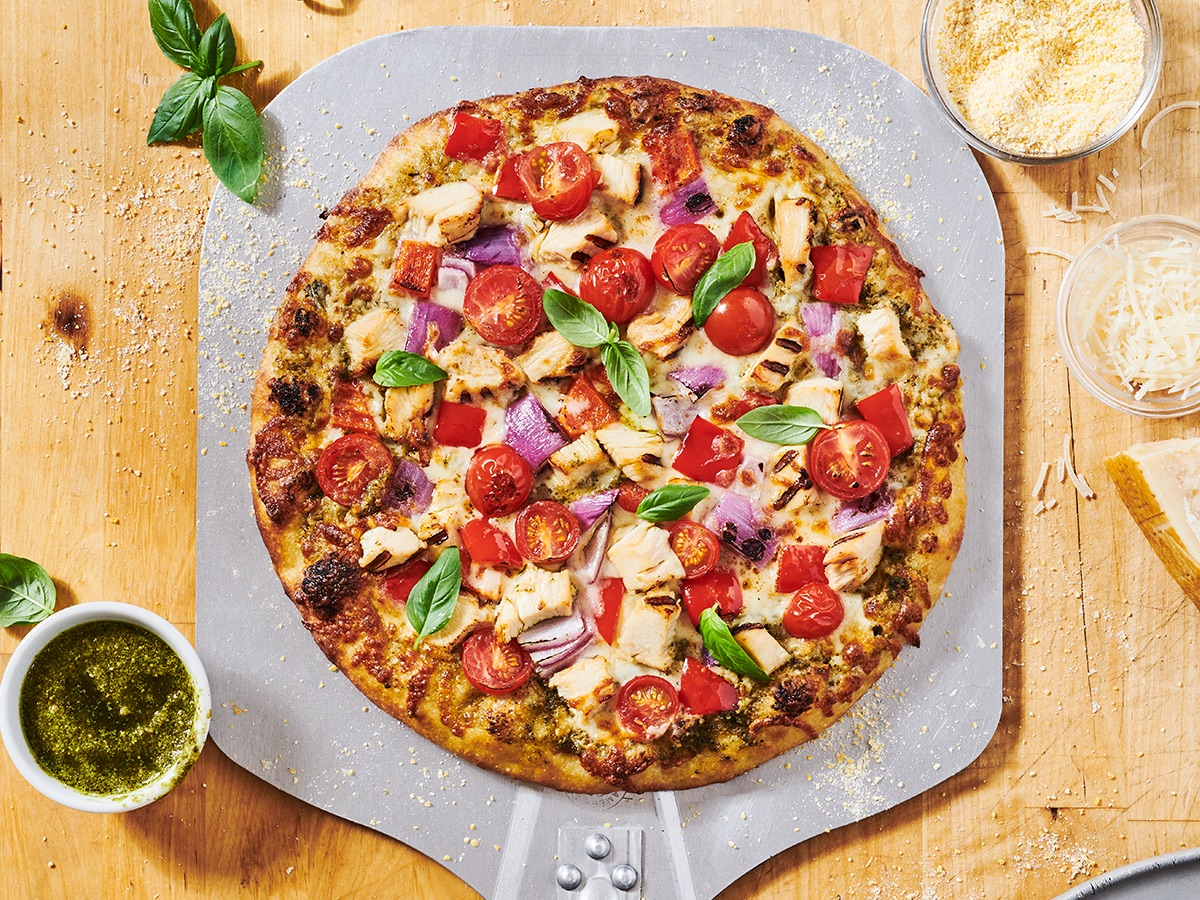 How to make Pesto Chicken Pizza featuring Tyson Red Label® Fully Cooked Premium Grilled Diced Breast Meat.