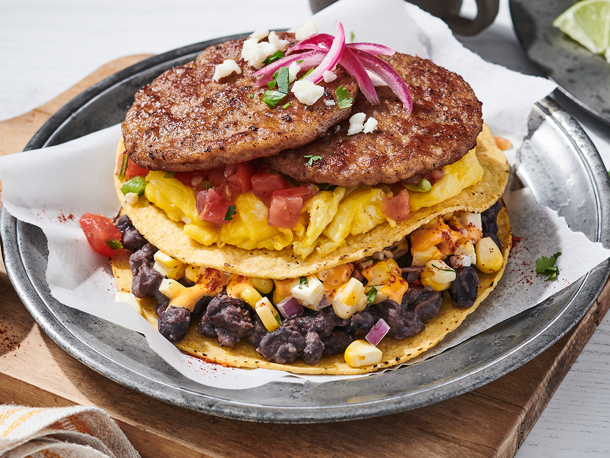 How to make an Elote Breakfast Tostada Stack Featuring Jimmy Dean® Fully Cooked Pork Sausage Patties and Mexican Original® Yellow Corn Round Tortilla Chips.