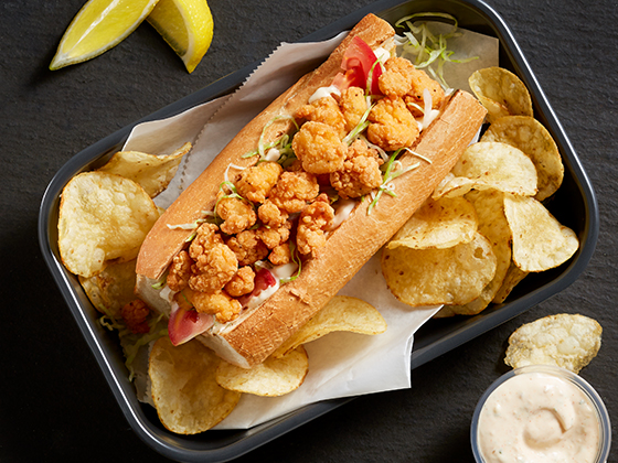 Tyson® Mini Chicken Bites served on a fresh chicken Po’ Boy Sandwich