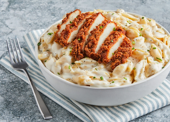 Appealing image of a Cheesy Chicken and Shells recipe with a Tyson Red Label® Authentically Crispy Spicy Chicken Breast Filet.